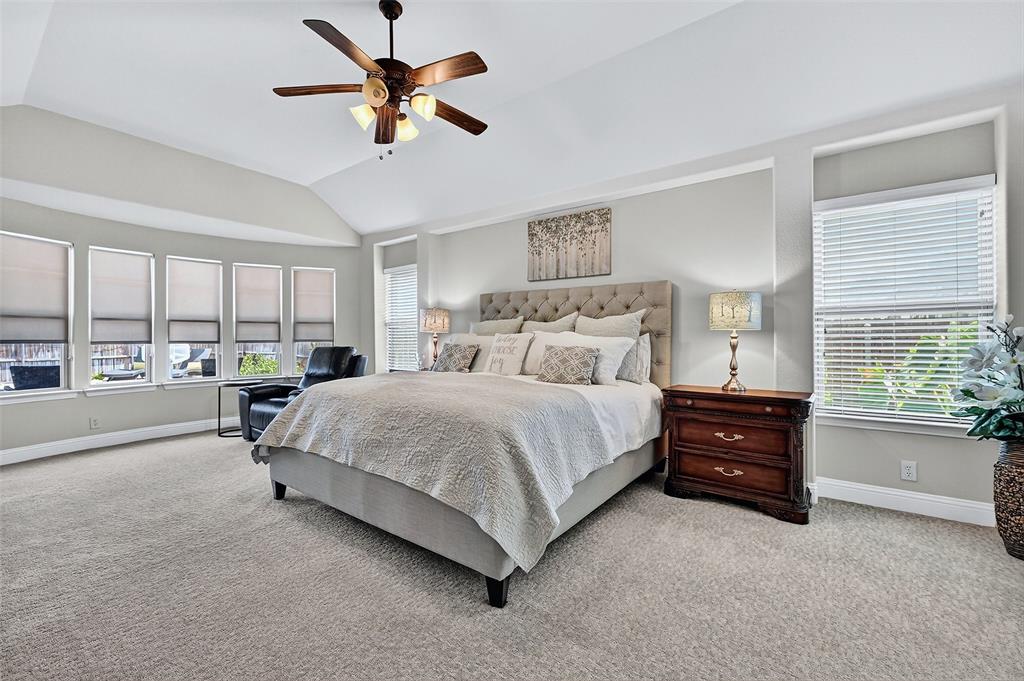 910 Calder Court Anna, TX 75409 - Photo 24 of 37 a bedroom with a bed and a large window