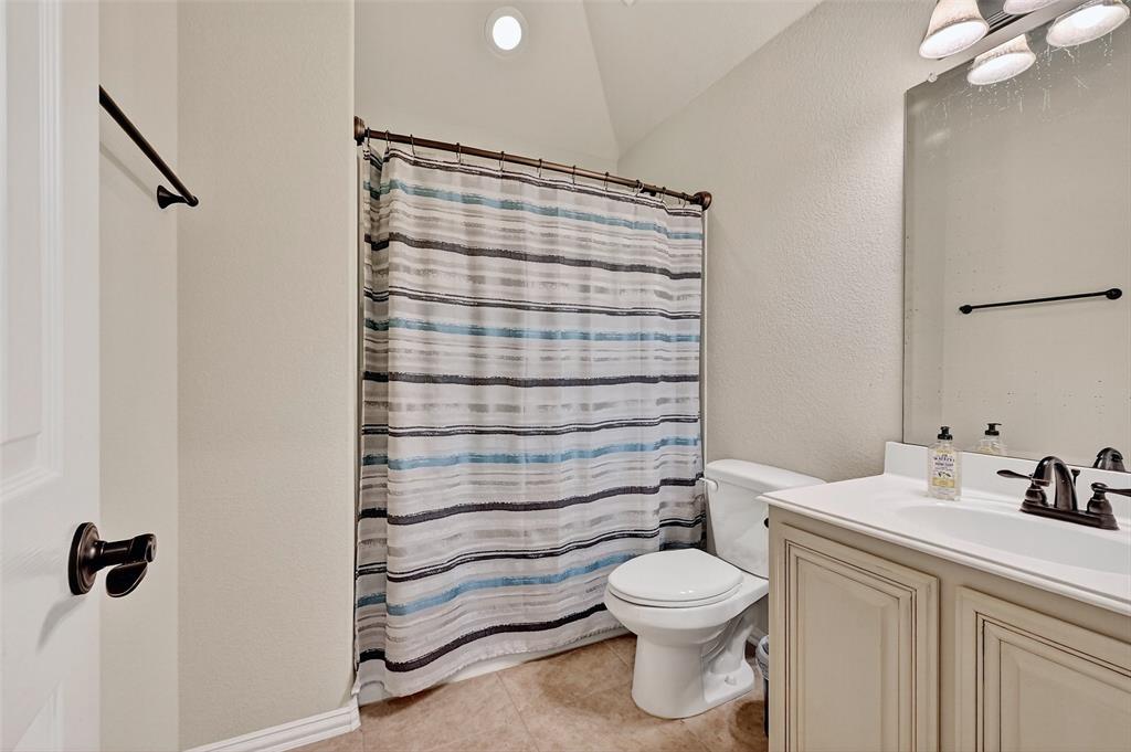 910 Calder Court Anna, TX 75409 - Photo 33 of 37 a bathroom with a toilet and a shower