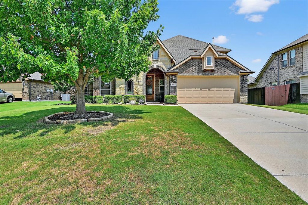 910 Calder Court Anna, TX 75409 - Photo 7 of 37 a front view of a house with a yard and trees