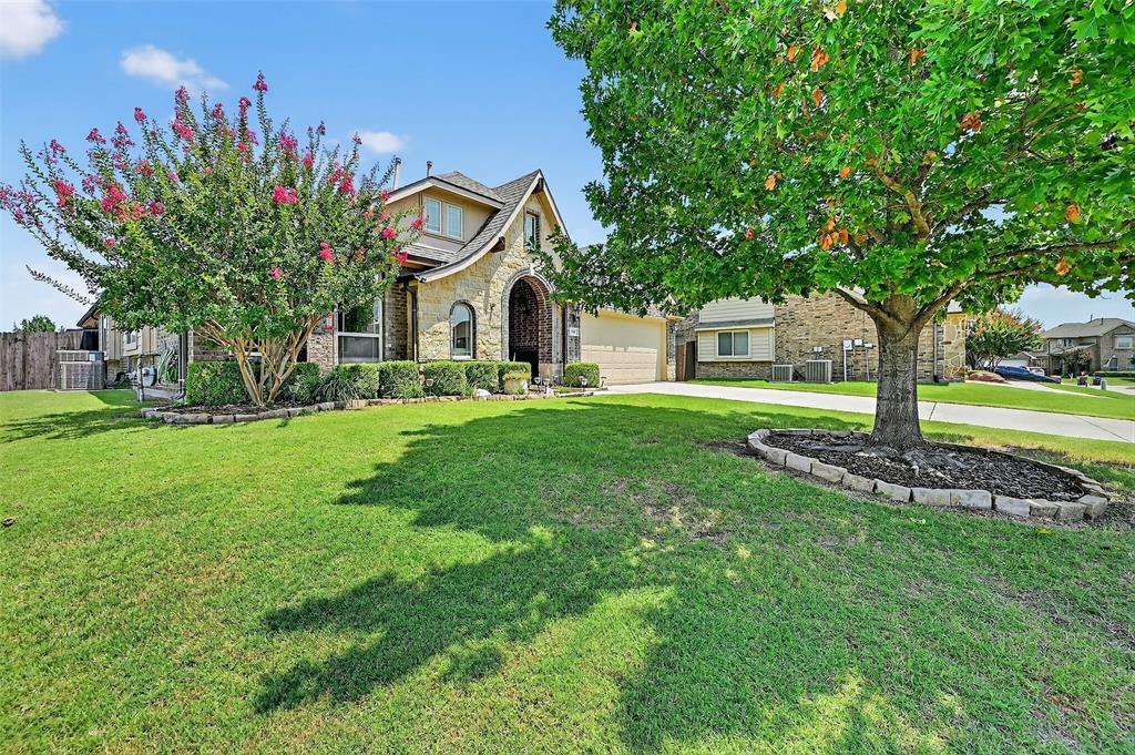 910 Calder Court Anna, TX 75409 - Photo 8 of 37 a front view of a house with garden