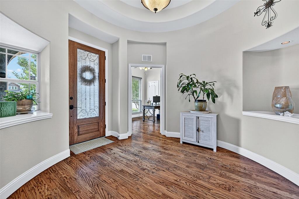 910 Calder Court Anna, TX 75409 - Photo 10 of 37 a room with wooden floor and a window