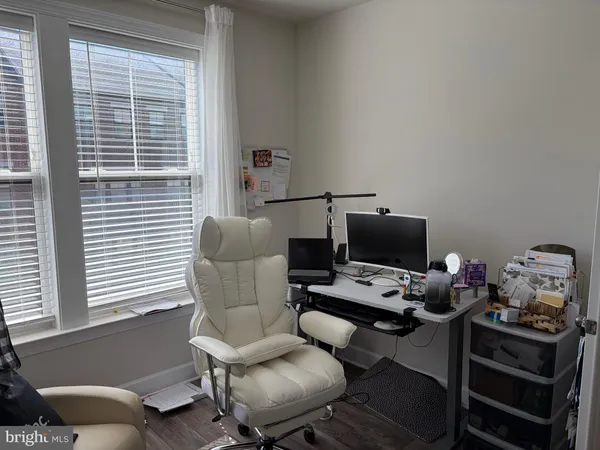 a work room with furniture and a window