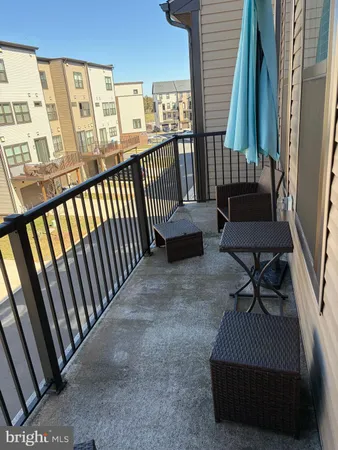 a view of balcony with furniture