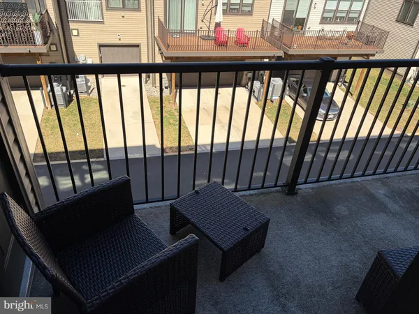 a view of a balcony with furniture