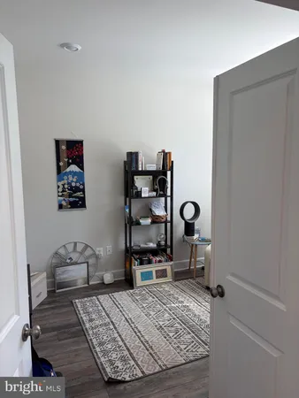 a bed room with a bed and a chair