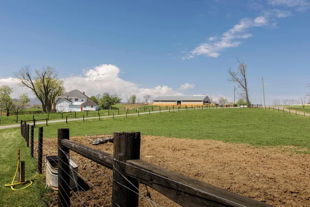 a aerial view of a house with pool table and chairs