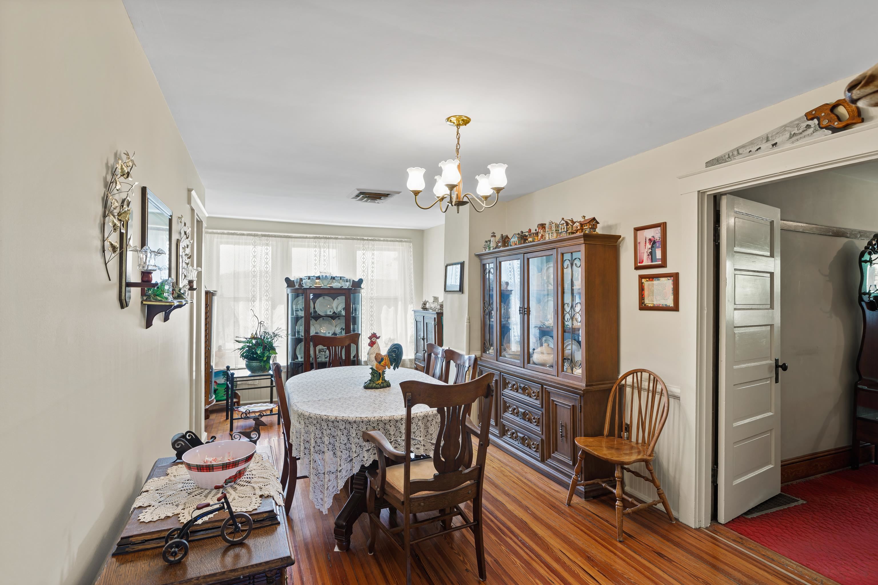 344 Free Mason Run Road Mount Solon, VA 22843 - Photo 28 of 45 a view of a livingroom with furniture a chandelier and wooden floor