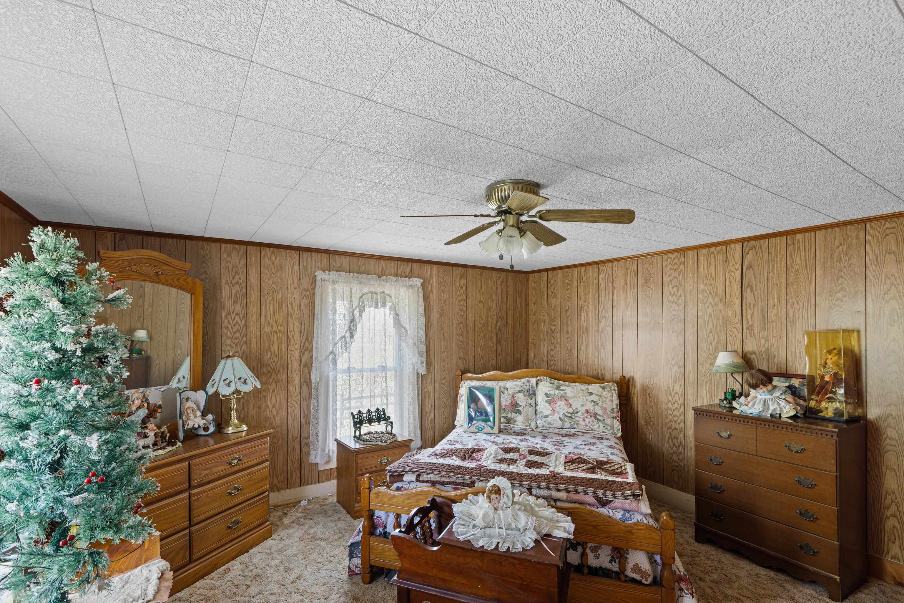 344 Free Mason Run Road Mount Solon, VA 22843 - Photo 32 of 45 a bedroom with a bed and a chandelier