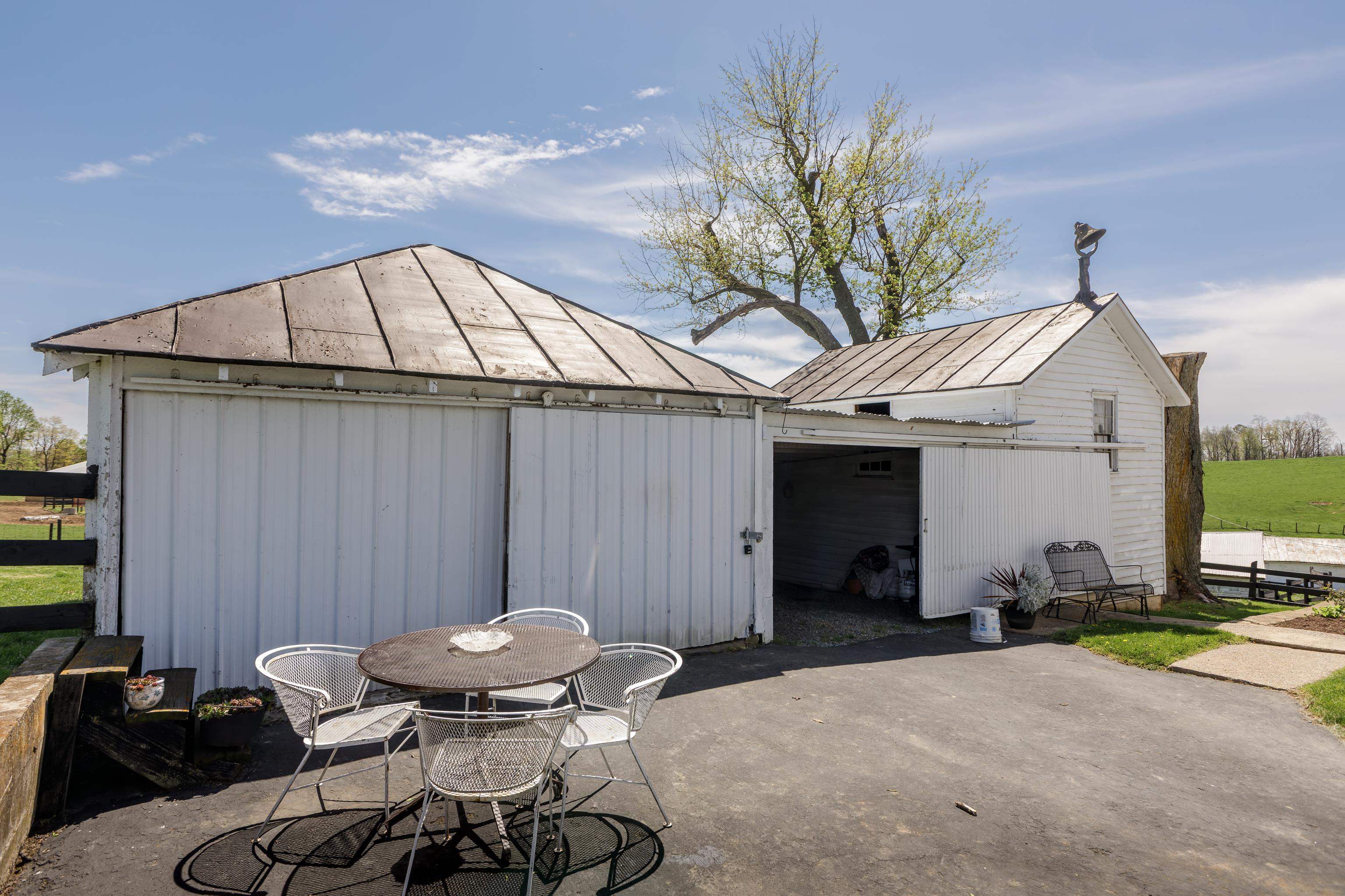 344 Free Mason Run Road Mount Solon, VA 22843 - Photo 35 of 45 a view of a patio with table and chairs and a barbeque