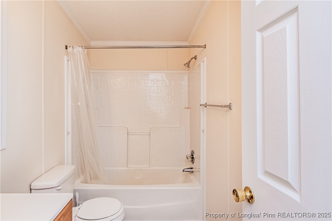 41 Dixie Trail Road Lumber Bridge, NC 28357 - Photo 25 of 33 a bathroom with a shower a toilet and a shower
