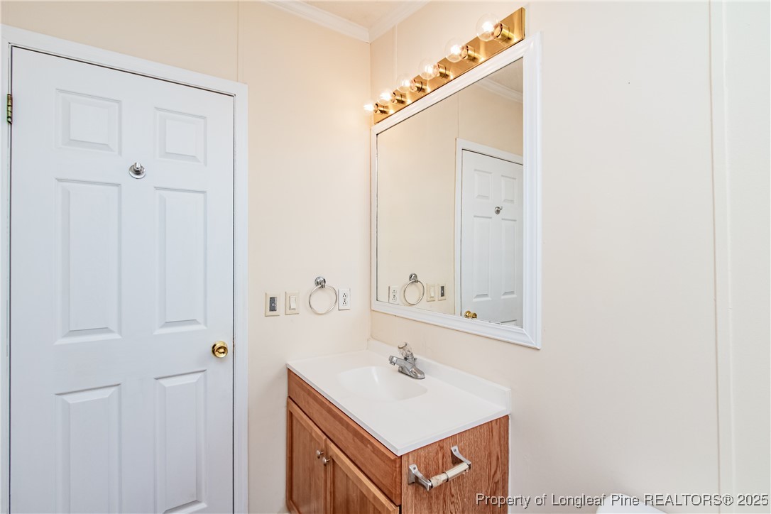 41 Dixie Trail Road Lumber Bridge, NC 28357 - Photo 26 of 33 a bathroom with a sink and a mirror