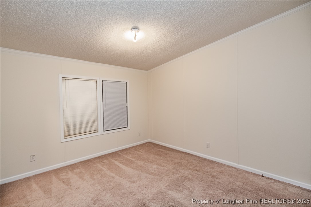 41 Dixie Trail Road Lumber Bridge, NC 28357 - Photo 27 of 33 an empty room with a empty space and window