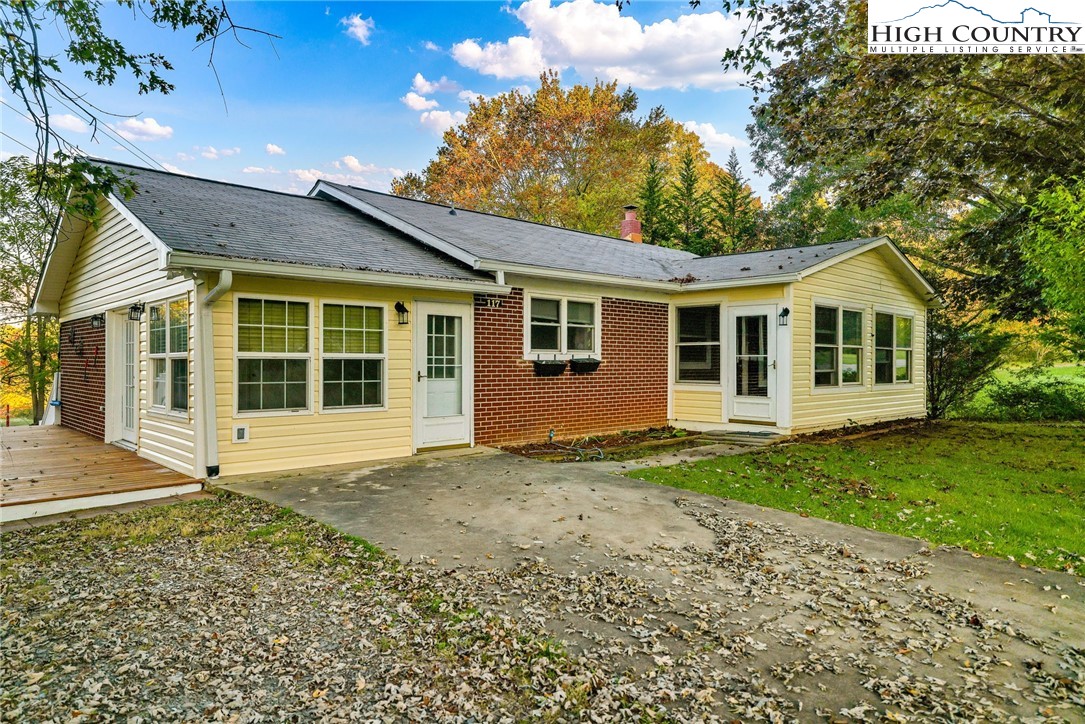 117 Andrews Ridge Road Sparta, NC 28675 - Photo 1 of 49 a view of a yard in front of a house with a large tree