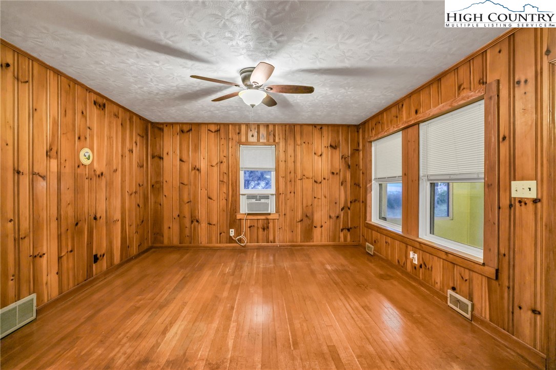 117 Andrews Ridge Road Sparta, NC 28675 - Photo 11 of 50 wooden floor in an empty room with a window