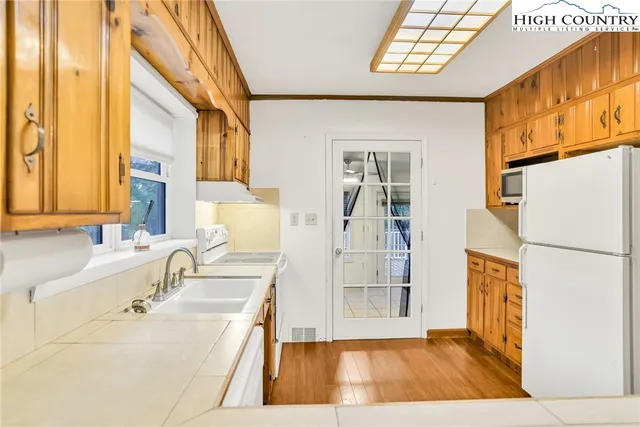 a kitchen with a sink and cabinets