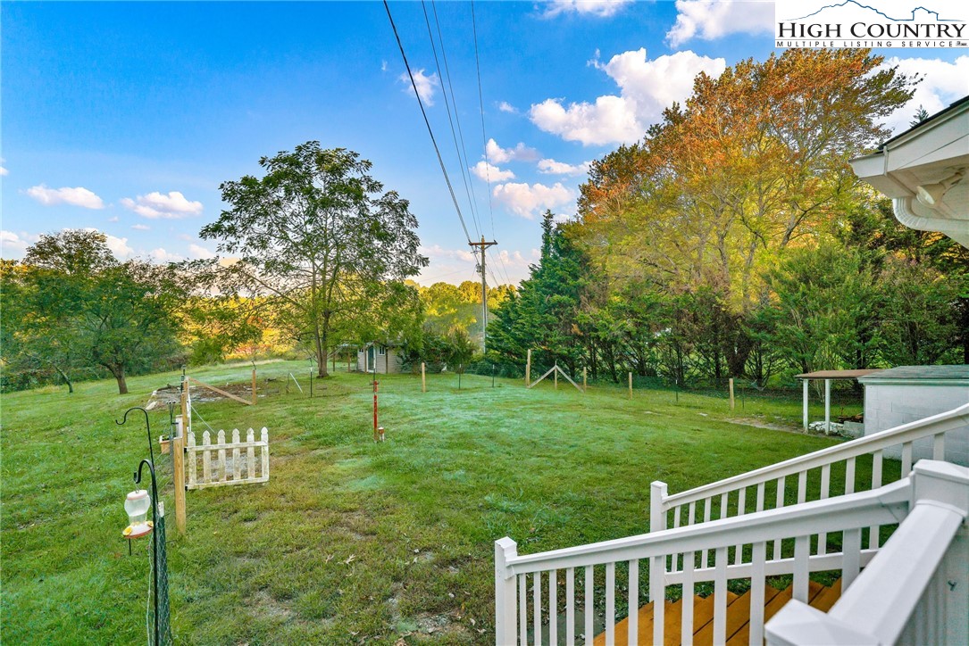 117 Andrews Ridge Road Sparta, NC 28675 - Photo 23 of 49 a view of a wooden deck and garden