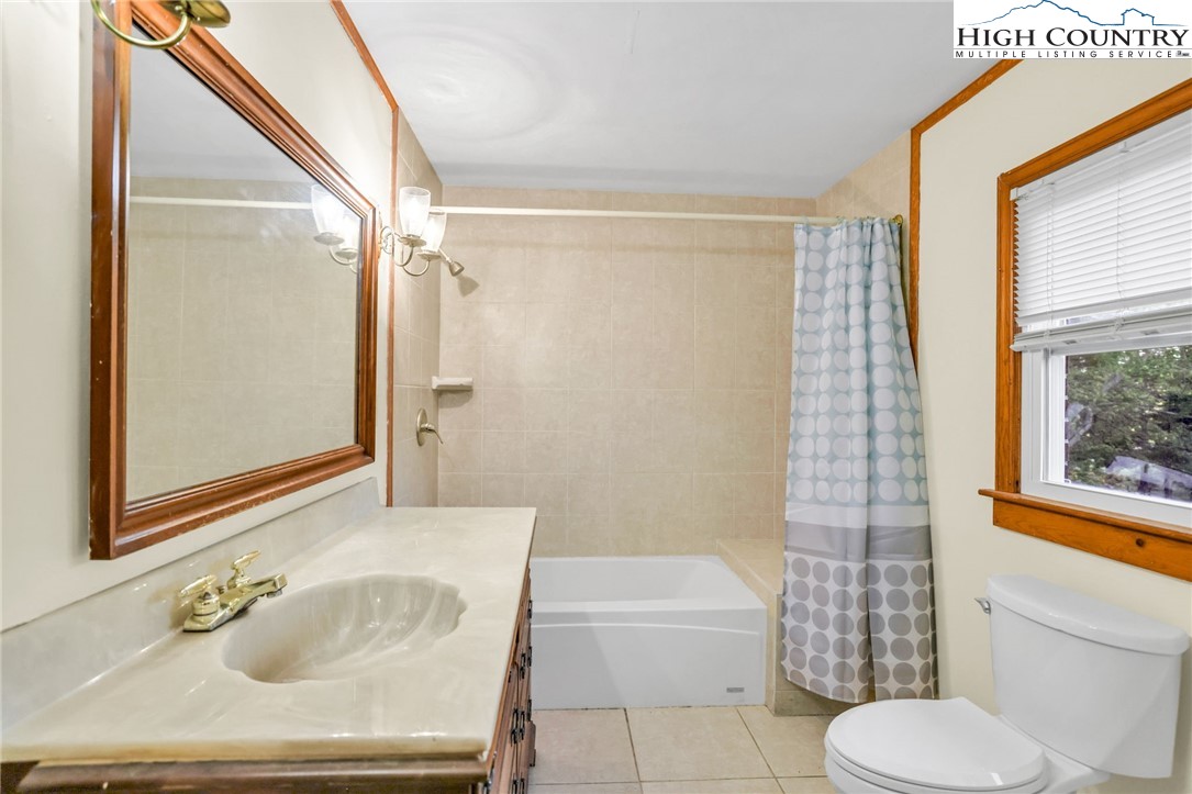 117 Andrews Ridge Road Sparta, NC 28675 - Photo 24 of 49 a bathroom with a sink toilet and shower