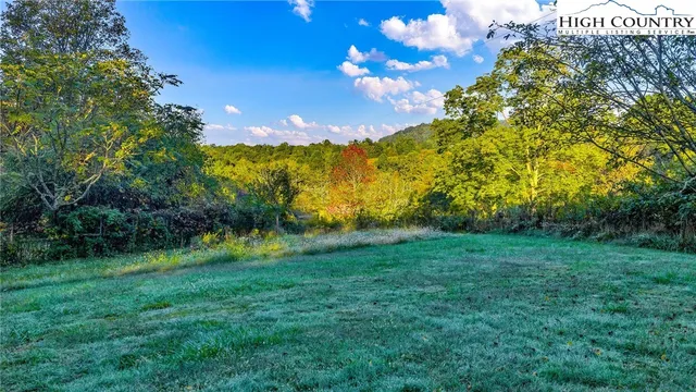 a view of houses with yard