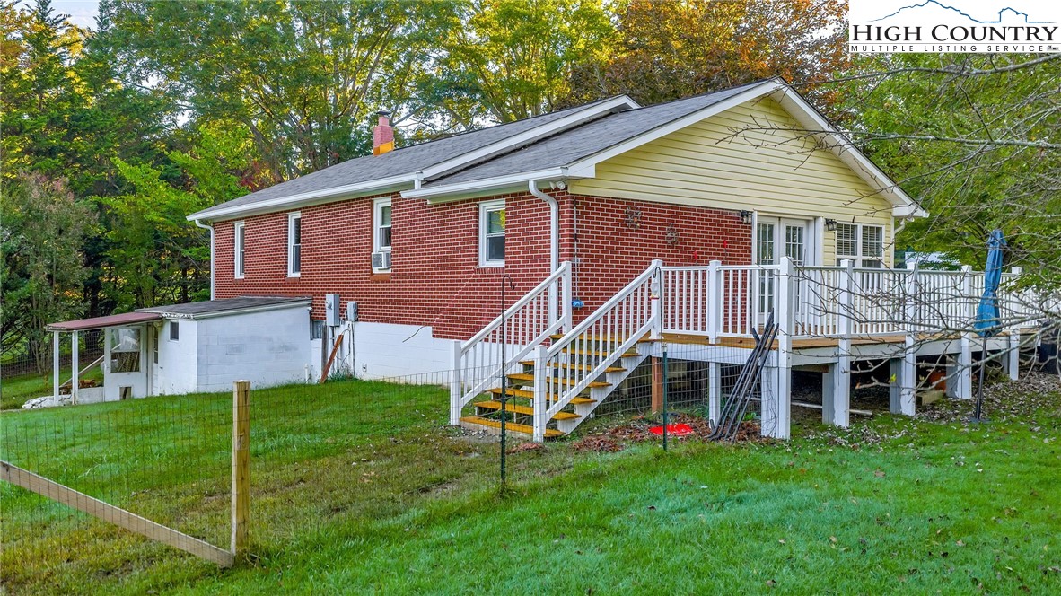 117 Andrews Ridge Road Sparta, NC 28675 - Photo 4 of 49 a view of a house with a yard and deck