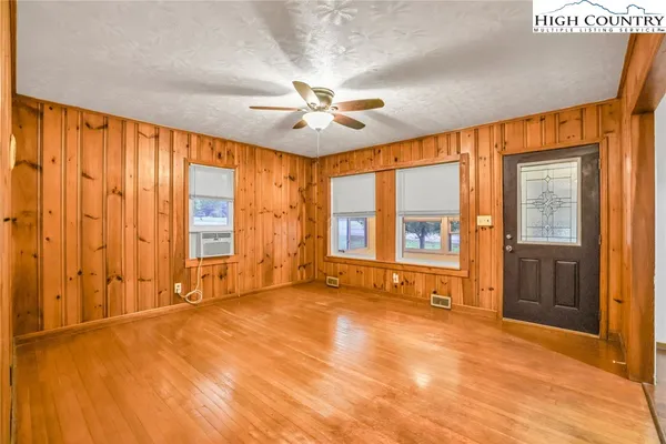 a view of an empty room with a window