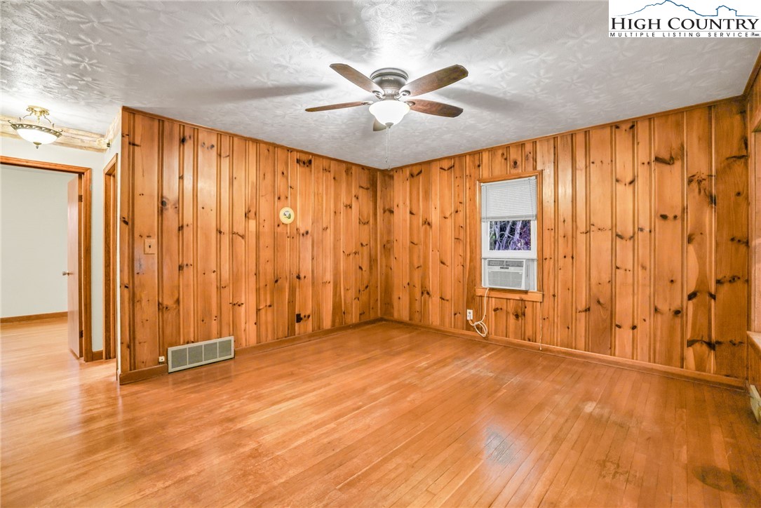 117 Andrews Ridge Road Sparta, NC 28675 - Photo 9 of 49 wooden floor in an empty room with a window