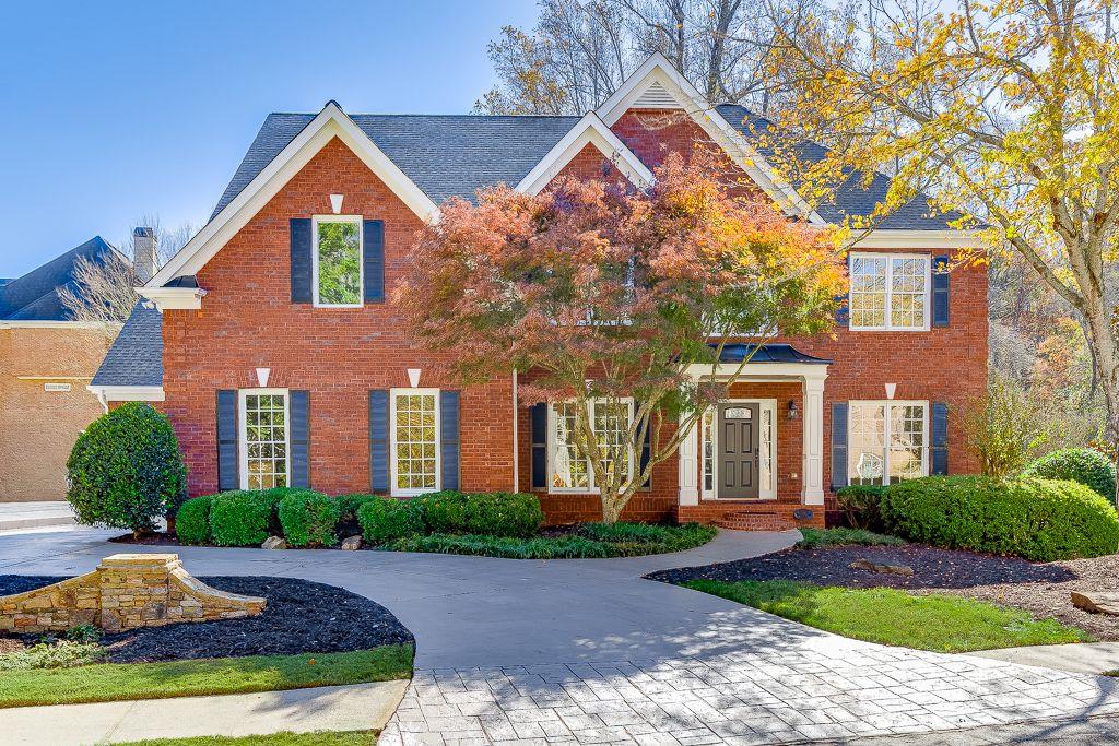 a front view of a house with yard