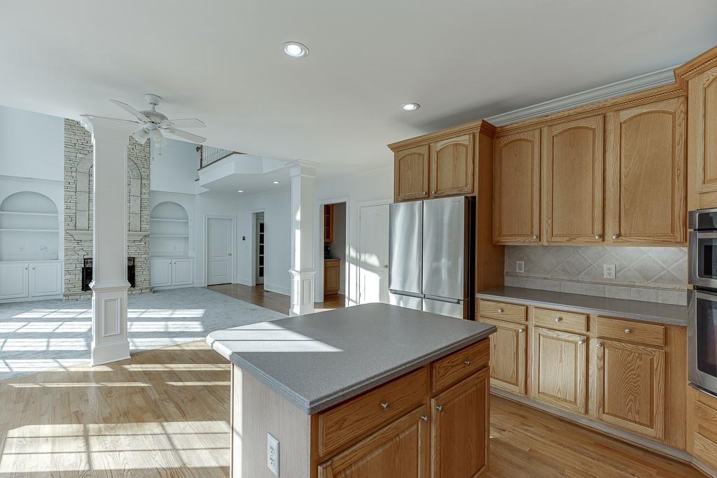 2747 Pathview Drive Dacula, GA 30019 - Photo 11 of 59 a kitchen with a sink refrigerator and cabinets