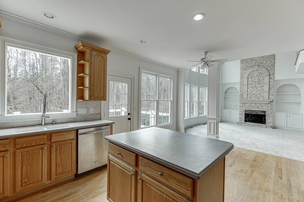 2747 Pathview Drive Dacula, GA 30019 - Photo 12 of 59 a kitchen with sink cabinets and wooden floor