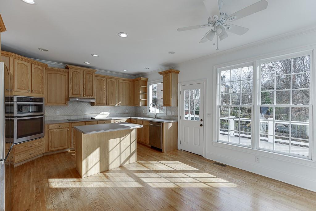 2747 Pathview Drive Dacula, GA 30019 - Photo 16 of 59 a kitchen with a stove a sink and a refrigerator