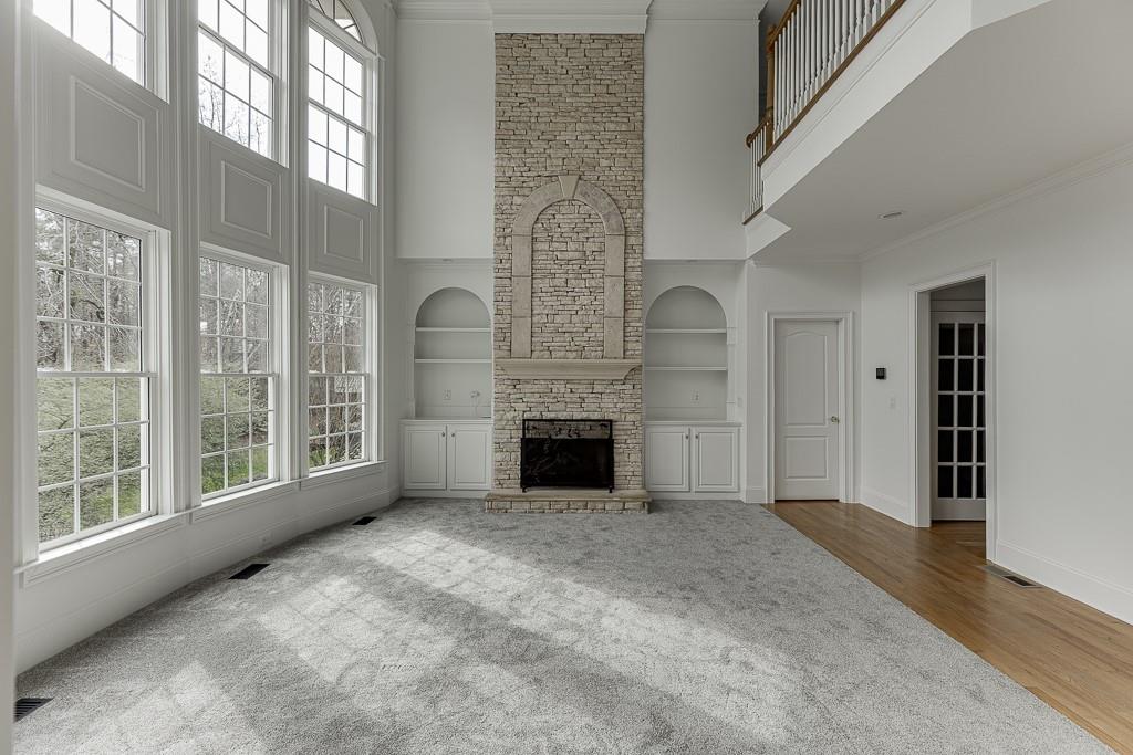 2747 Pathview Drive Dacula, GA 30019 - Photo 19 of 59 a view of a livingroom with an empty space and a fireplace
