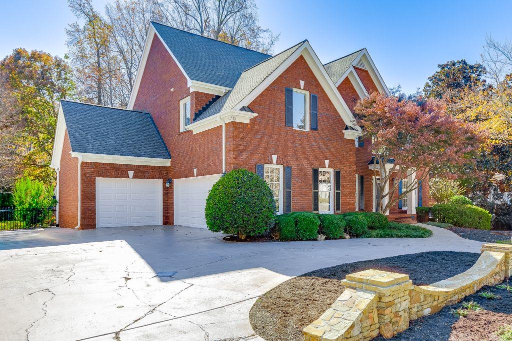 2747 Pathview Drive Dacula, GA 30019 - Photo 2 of 59 a front view of a house with garden