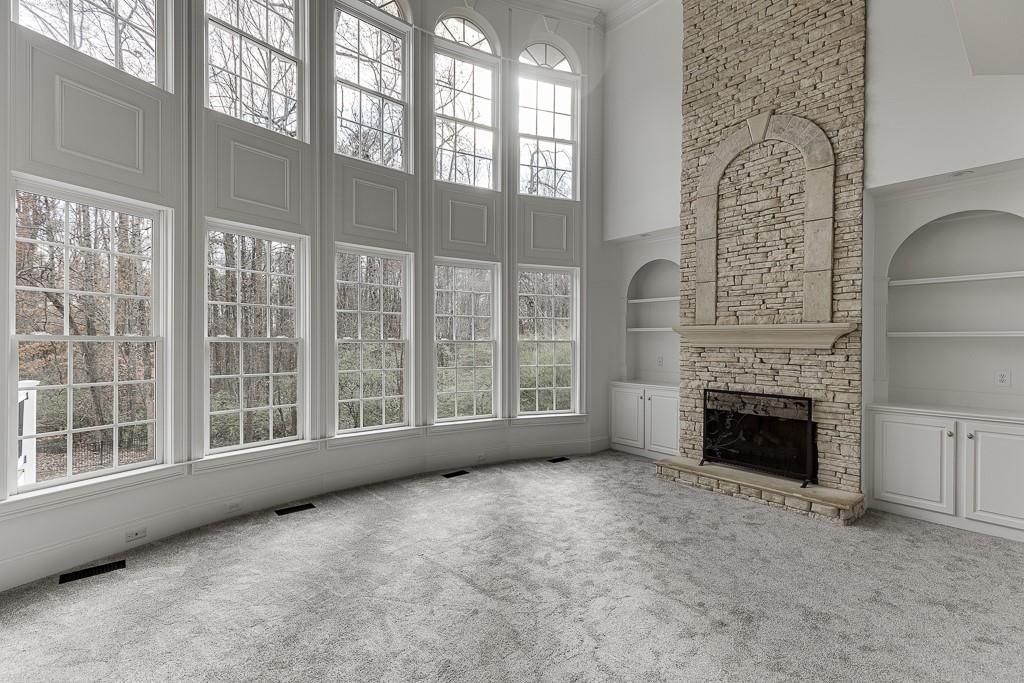 2747 Pathview Drive Dacula, GA 30019 - Photo 21 of 59 a view of an empty room with a fireplace