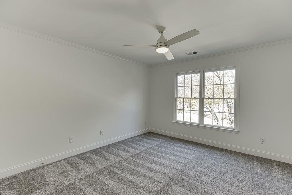 2747 Pathview Drive Dacula, GA 30019 - Photo 26 of 59 an empty room with a window and a fan
