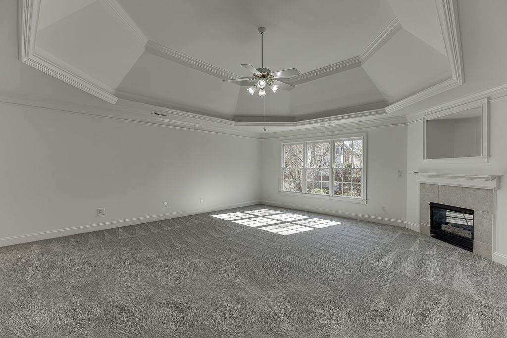 2747 Pathview Drive Dacula, GA 30019 - Photo 38 of 59 a view of an empty room with a fireplace and a window