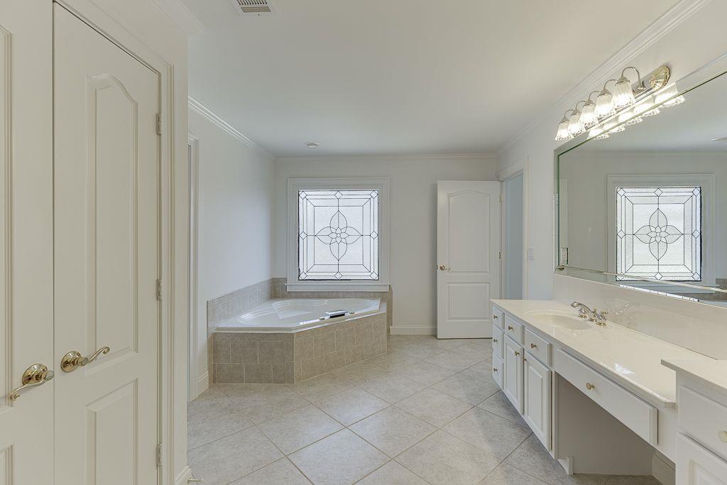 2747 Pathview Drive Dacula, GA 30019 - Photo 43 of 59 a bathroom with a tub sink and mirror