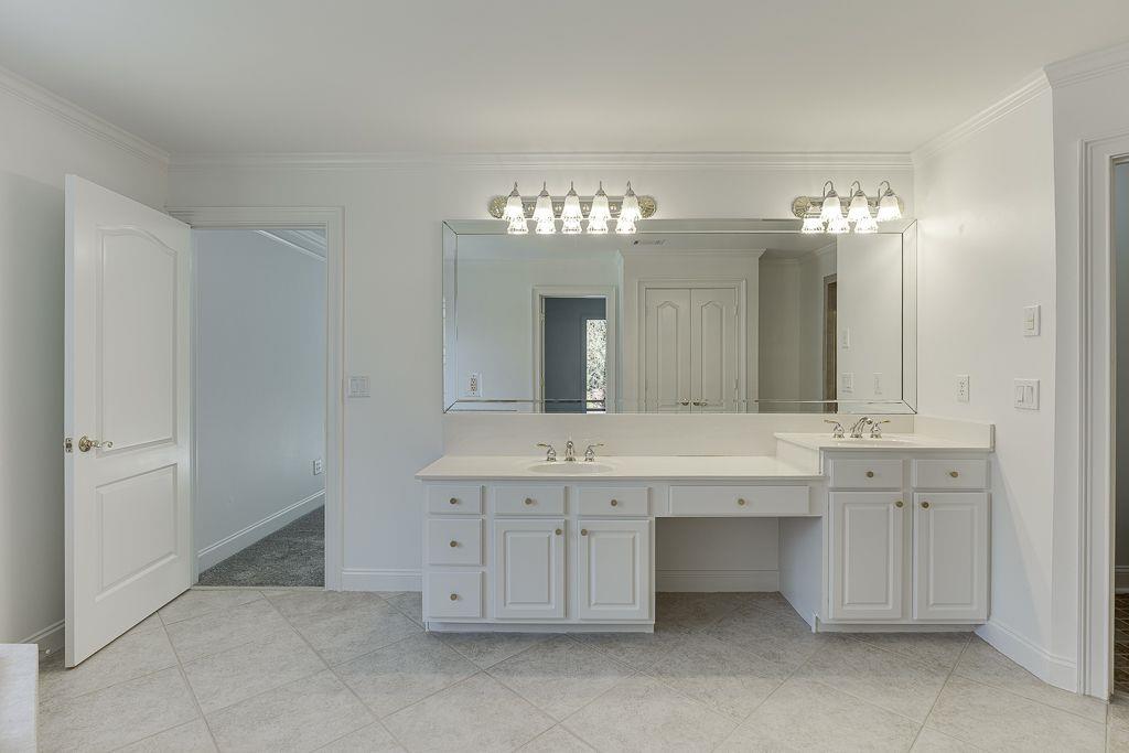 2747 Pathview Drive Dacula, GA 30019 - Photo 44 of 59 a spacious bathroom with a double vanity sink and a mirror