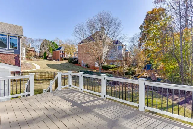 an aerial view of a house with swimming pool and patio
