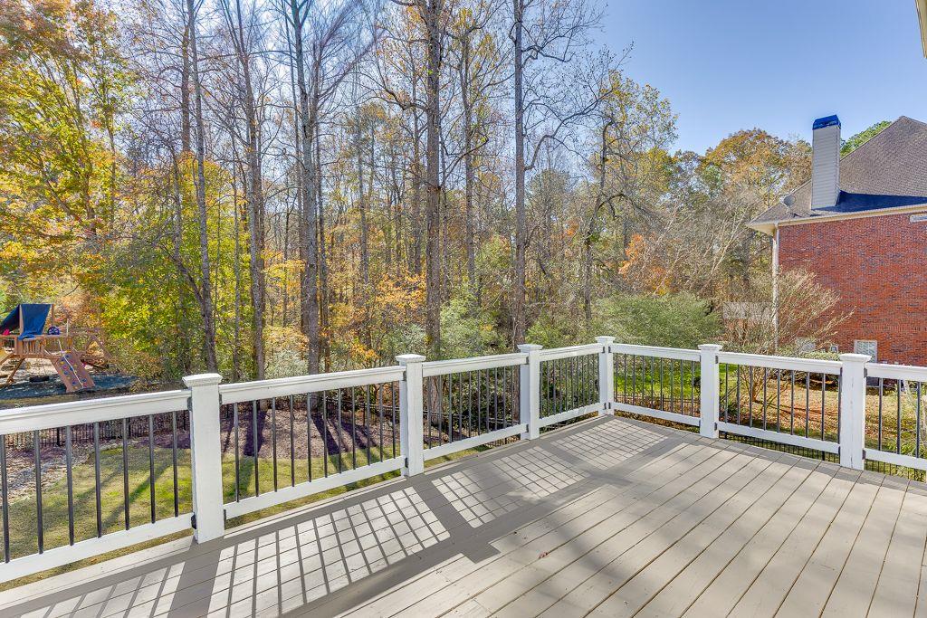 2747 Pathview Drive Dacula, GA 30019 - Photo 47 of 59 a view of a balcony with wooden floor and fence