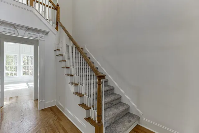 a view of entryway and hall with wooden floor