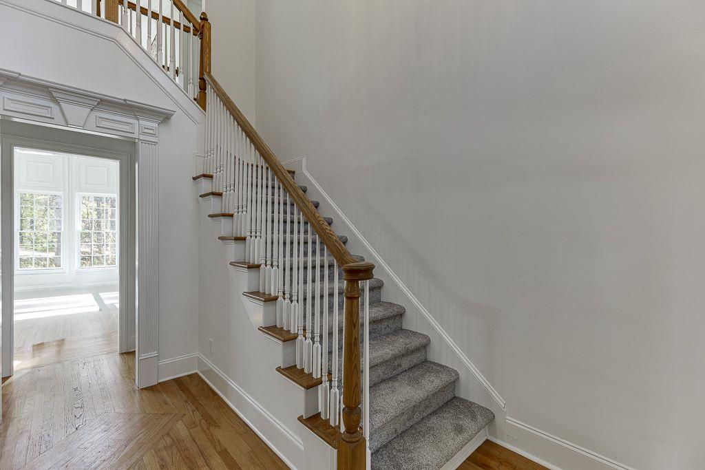 2747 Pathview Drive Dacula, GA 30019 - Photo 8 of 59 a view of entryway and hall with wooden floor