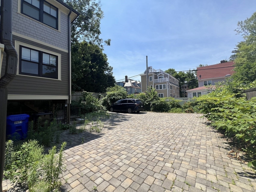 23 Winslow Road, Unit 1 Brookline, MA 02446 - Photo 26 of 27 a pathway of a house with a yard