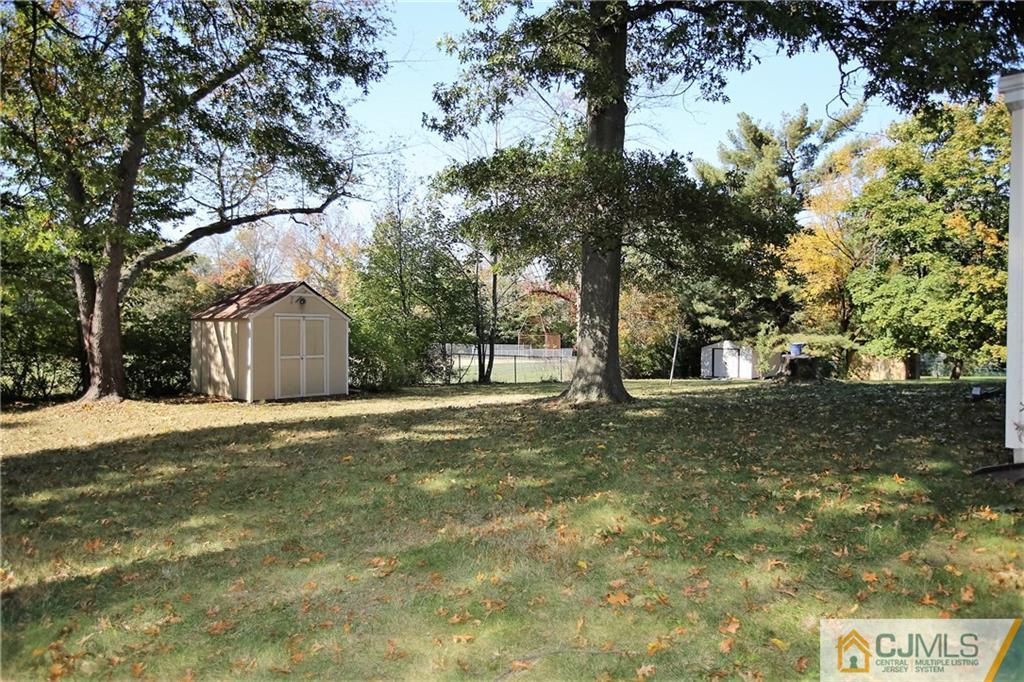 41 New Road Kendall Park, NJ 08824 - Photo 22 of 25 a view of a tree in front of a house