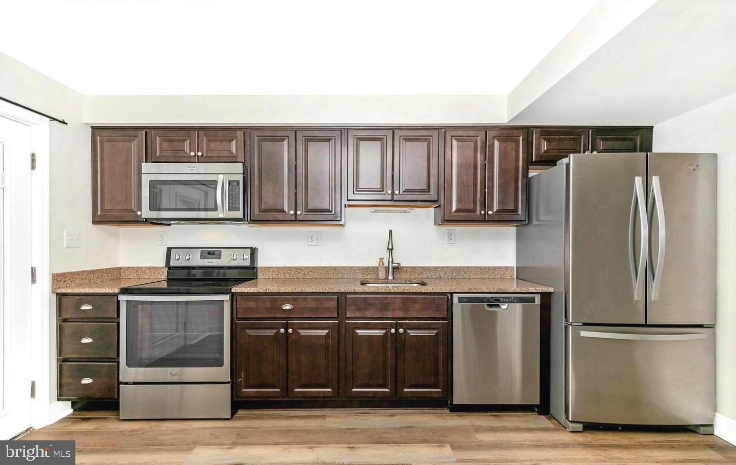459 Arwell Court Frederick, MD 21703 - Photo 5 of 19 a kitchen with stainless steel appliances granite countertop a refrigerator stove and sink