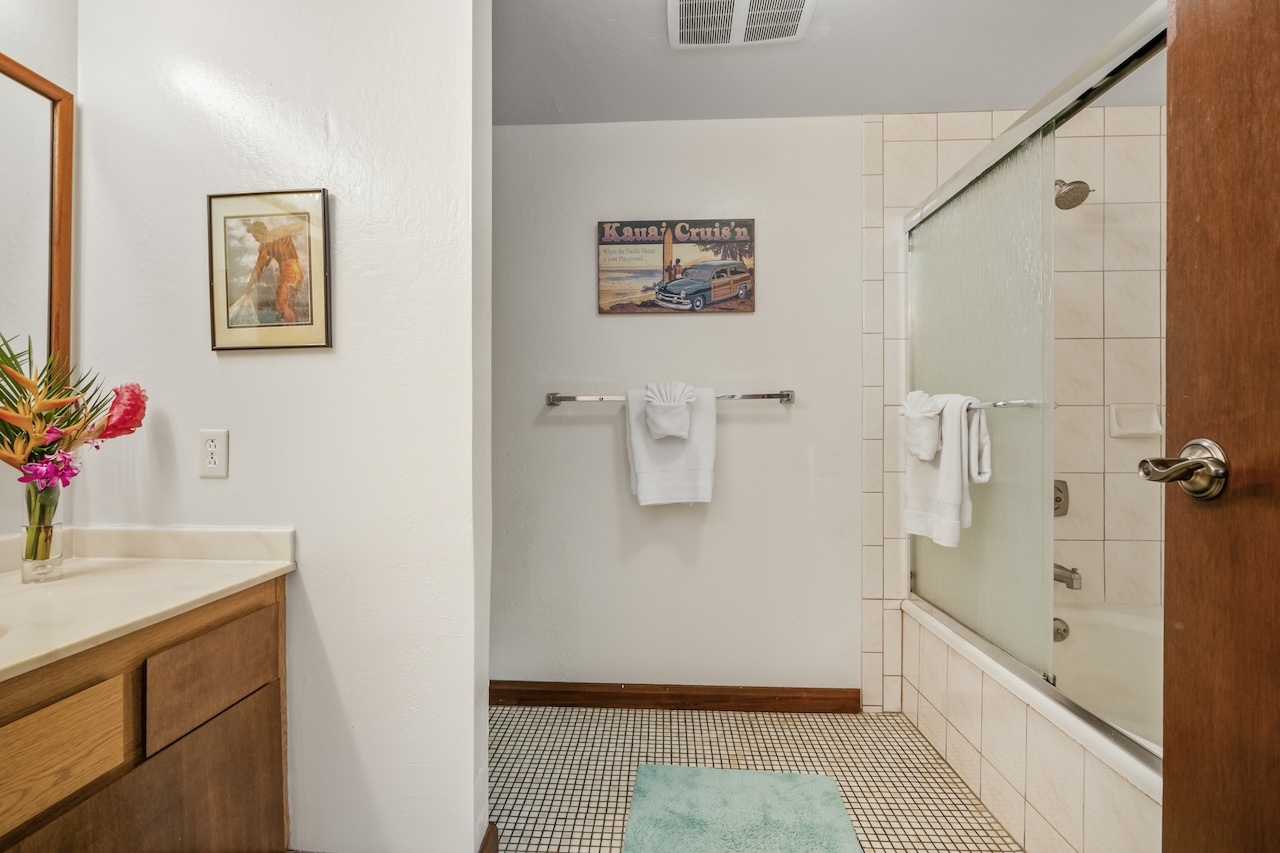 1901 Poipu Road, Unit 411 Koloa, HI 96756 - Photo 13 of 28 a bathroom with a sink and mirror