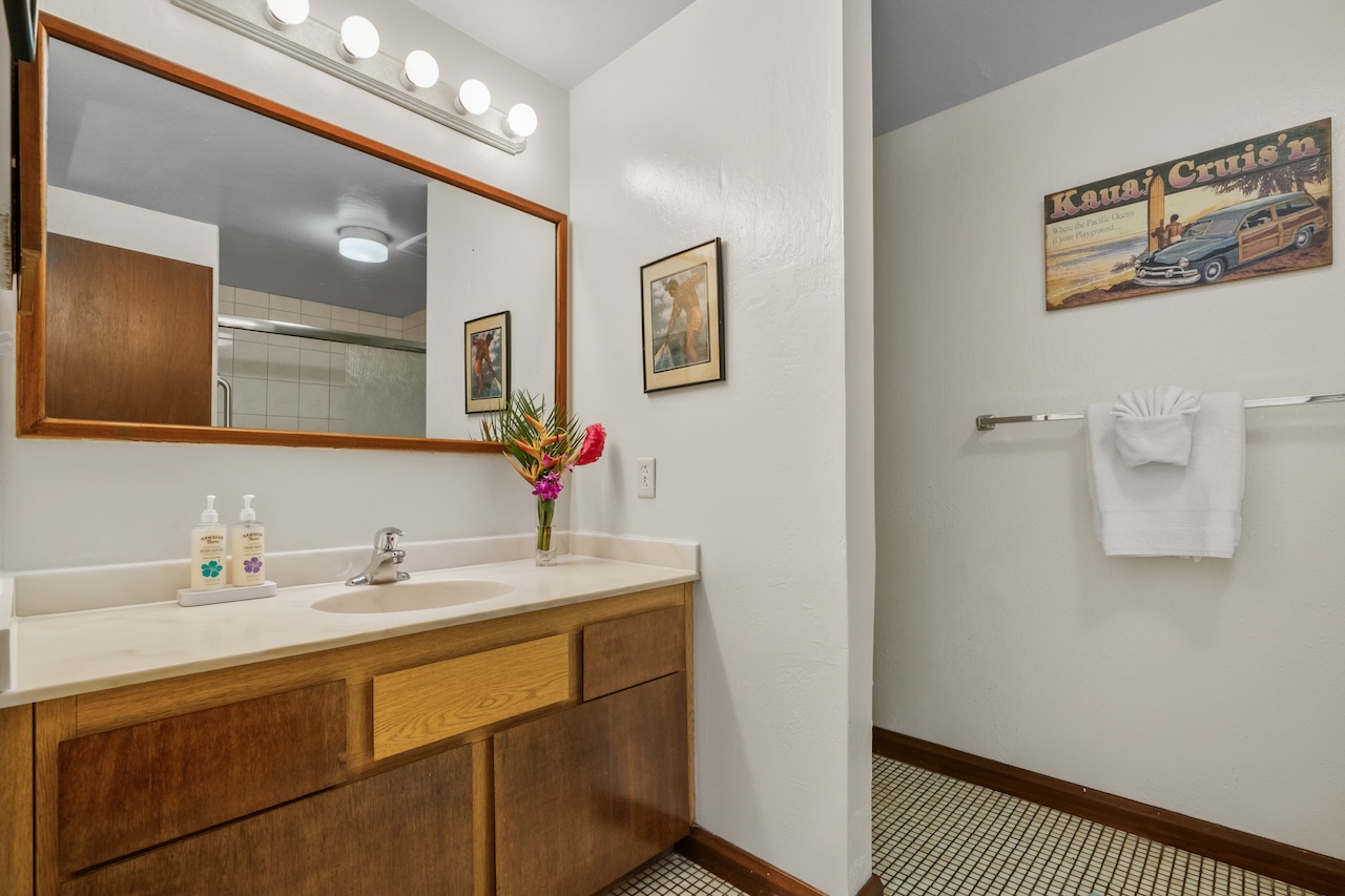 1901 Poipu Road, Unit 411 Koloa, HI 96756 - Photo 14 of 28 a bathroom with a sink and a mirror