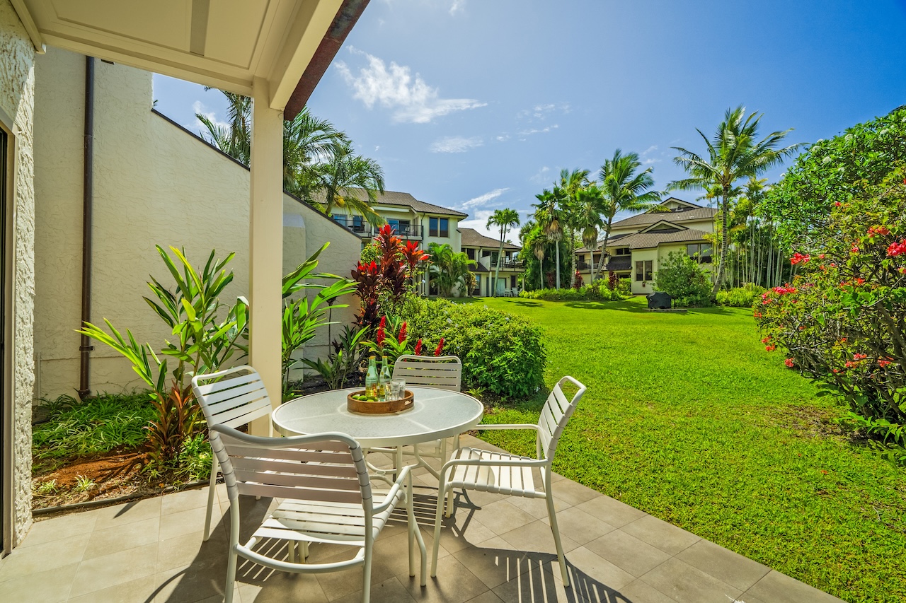 1901 Poipu Road, Unit 411 Koloa, HI 96756 - Photo 19 of 28 a view of outdoor dining space with a garden and plants