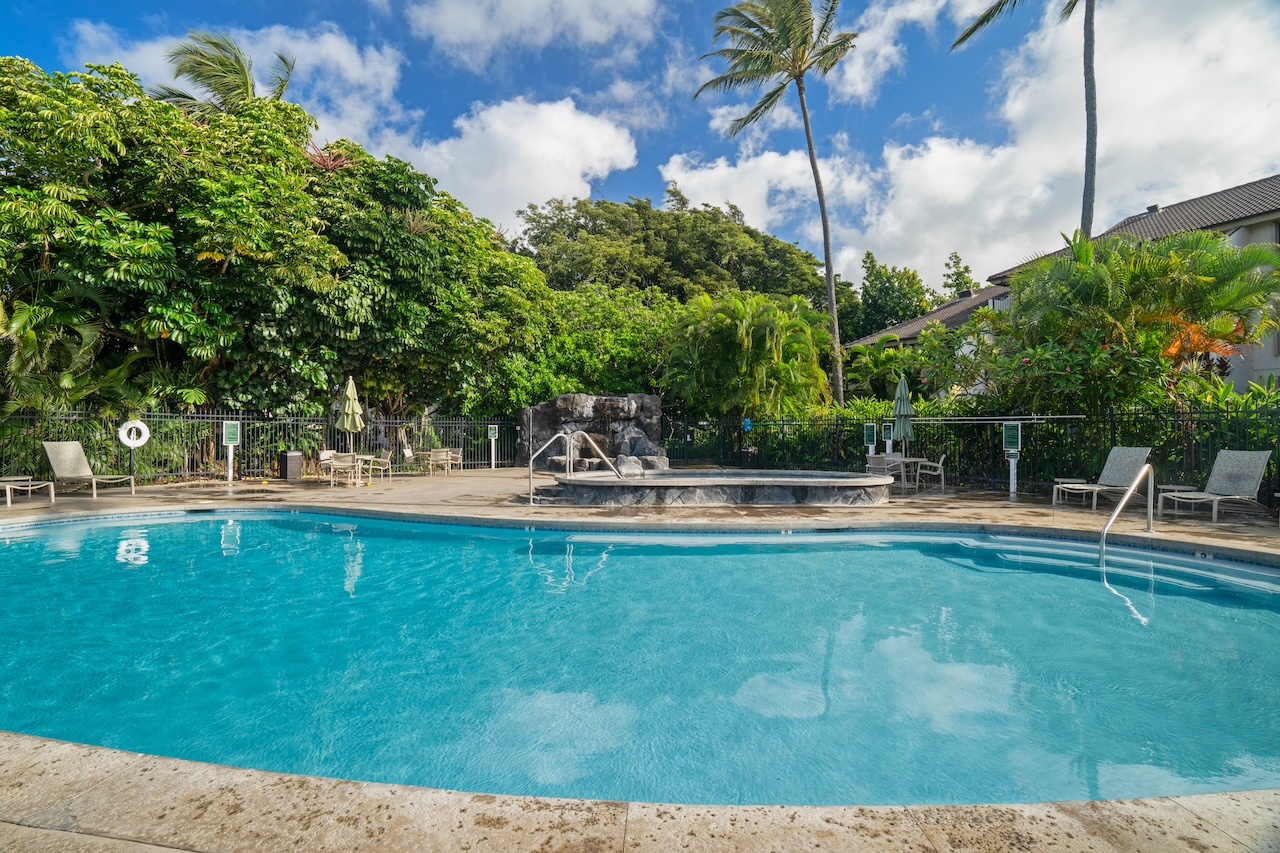 1901 Poipu Road, Unit 411 Koloa, HI 96756 - Photo 22 of 28 a swimming pool with outdoor seating and yard
