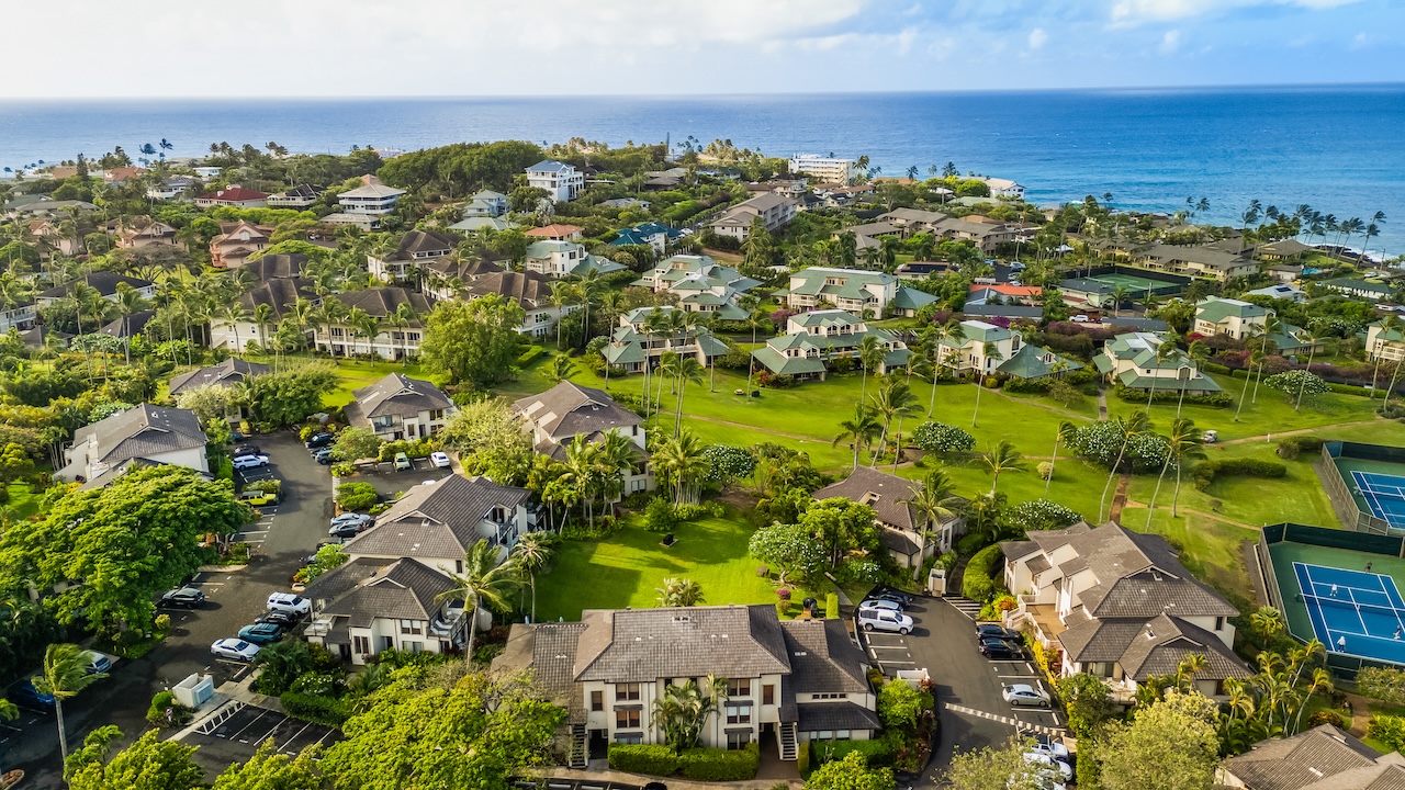 1901 Poipu Road, Unit 411 Koloa, HI 96756 - Photo 28 of 28 an aerial view of residential houses with outdoor space and trees