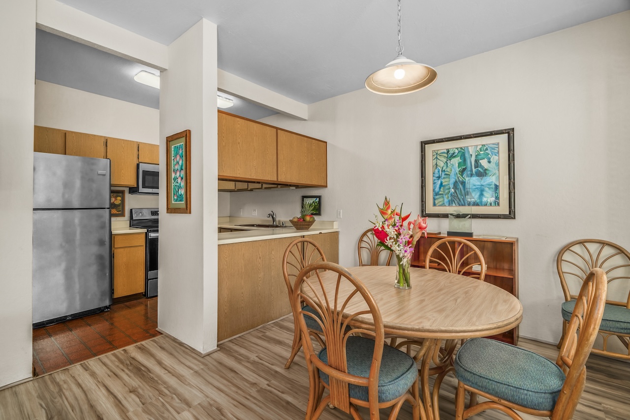 1901 Poipu Road, Unit 411 Koloa, HI 96756 - Photo 8 of 28 a view of a dining room with furniture window and wooden floor