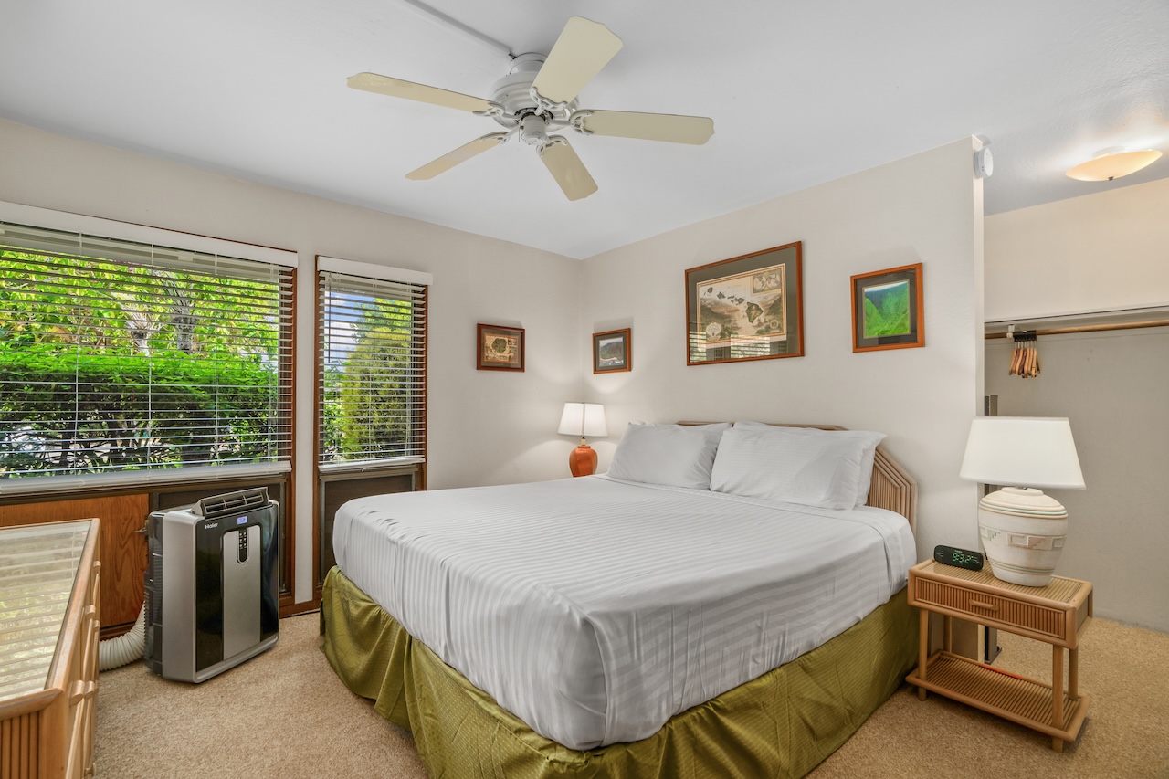 1901 Poipu Road, Unit 411 Koloa, HI 96756 - Photo 10 of 28 a bedroom with a bed and a table